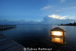 Clouds over the mainland at sunset, Laguna Beach, Utila. ... by Tobias Reitmayr 